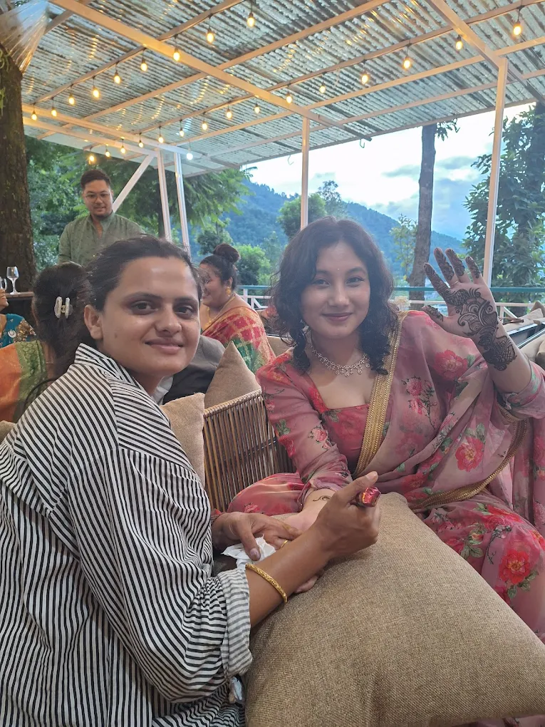 Close up of henna artist working.